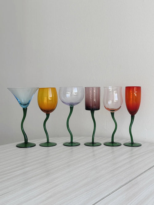 colored glasses with green twisted stems
